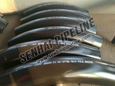 How to reduce noise in a piping system with carbon steel tees?